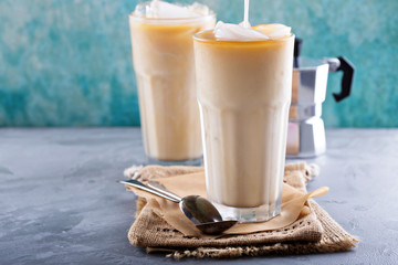 Iced coffee with milk in tall glasses