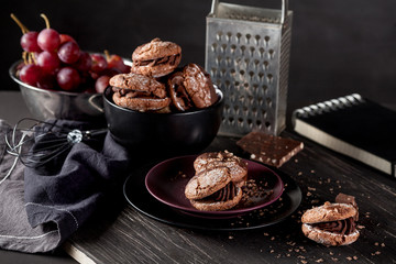 Organic almond cookies on dark wooden background