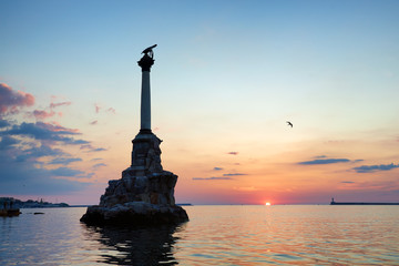 Monument to flooded ships in Sevastopol bay on sunset