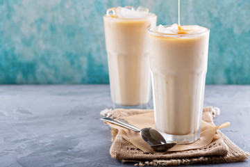 Iced coffee with milk in tall glasses
