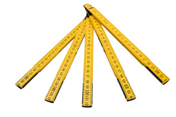 Folding ruler isolated, yellow carpenter's rule with centimeters numbers.
