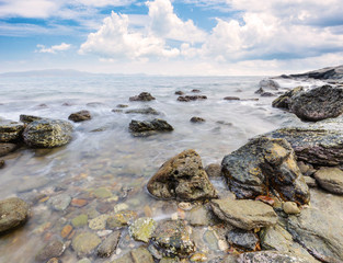 Fototapeta na wymiar Long exposure shot. Sea scape with stone beach at Thailand