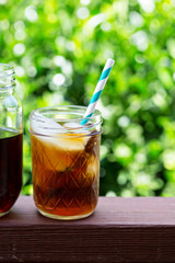 Iced coffee in mason jars outdoors