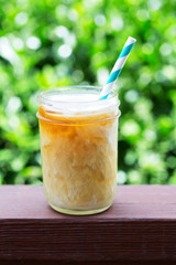 Iced coffee in mason jars outdoors