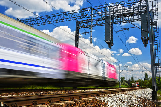 Fototapeta Modern electric passenger train moving on full speed