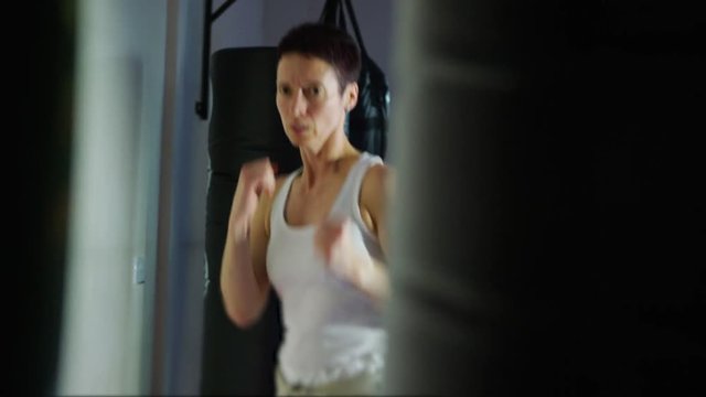  Serious female martial artist in training at the gym