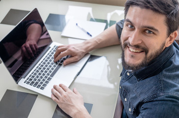 Fototapeta premium Businessman with his laptop