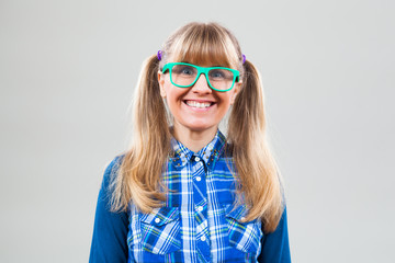 Studio shot portrait of happy nerdy woman