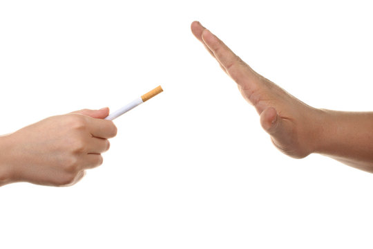 a man offers a cigarette with the orange filters and someone refuses on a white isolated background and someone refuses
