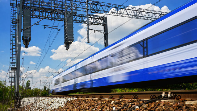 Fototapeta Modern electric passenger train moving on full speed