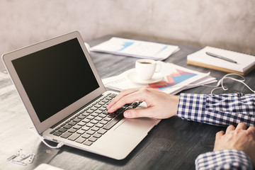 Man typing on laptop