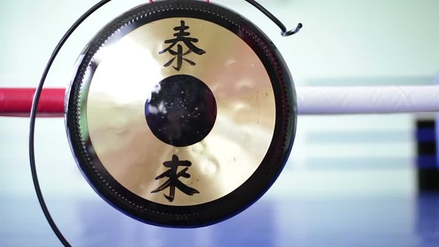 Metal gong near boxing ring