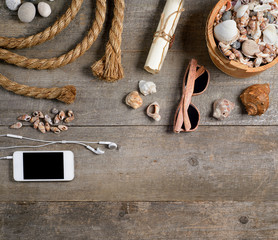 Travel items on wooden table. Summer time sea vacation background. Top view with copy space