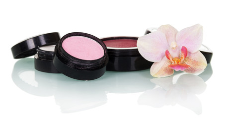 Obraz na płótnie Canvas Professional makeup: eye shadow, blush and orchid flower isolated.