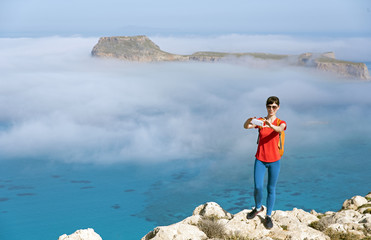 A girl getting selfie in front of the sea