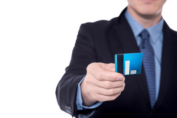 Image of businessman's hand holding cash card.