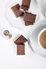 Cup of coffee and  bottle of milk and chocolate milkshake, top v