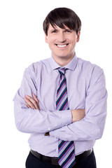 Cheerful businessman looking at the camera.