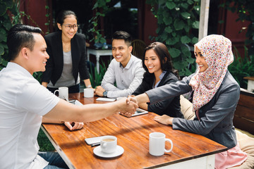 Business people shaking hands, finishing up a meeting