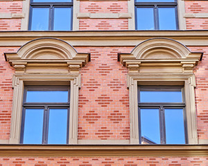 twin windows on elegant house facade