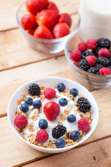 Healthy and nutritious yogurt with cereal and fresh raw berries
