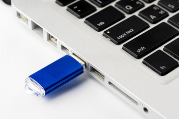 USB Flash drive on computer laptop keyboard