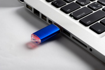 USB Flash drive on computer laptop keyboard