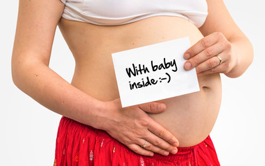Pregnant woman with inscription: Baby inside