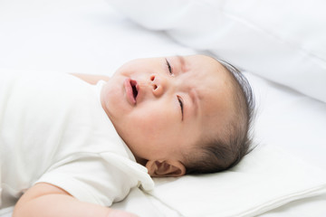 Fototapeta na wymiar Newborn Asian baby crying