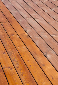 Patio Wooden Deck Floor Freshly Stained With Wood Oil. Before And After Varnishing Effect. Home Improvement Concept.