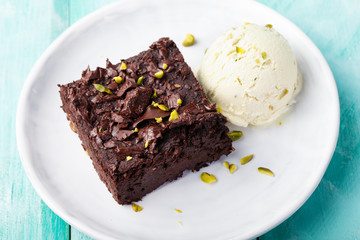 Chocolate brownie, cake on a white plate