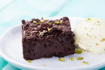 Chocolate brownie, cake on a white plate