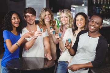 Group of friends having shots