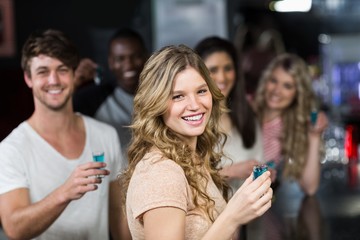 Group of friends having shots