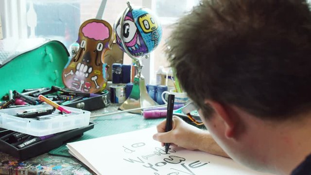  Modern graphic artist at work in his studio