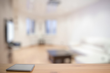 tablet on wooden table