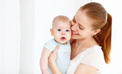 happy family mother playing  with baby