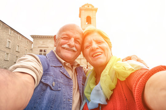 Senior Couple Taking A Selfie In Old Town Center 