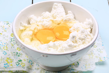 Obraz na płótnie Canvas cottage cheese with raw chicken eggs homemade food eco product