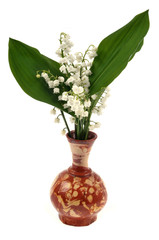 Brins de muguet dans un vase