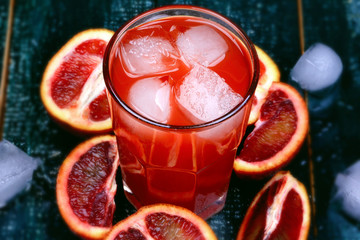 Fresh juice from blood oranges ice wooden retro cool summer drink