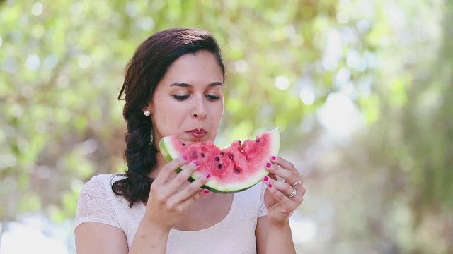 Woman eating watermelon
