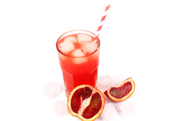 fresh squeezed juice from blood oranges with ice on a white background summer refreshing drink