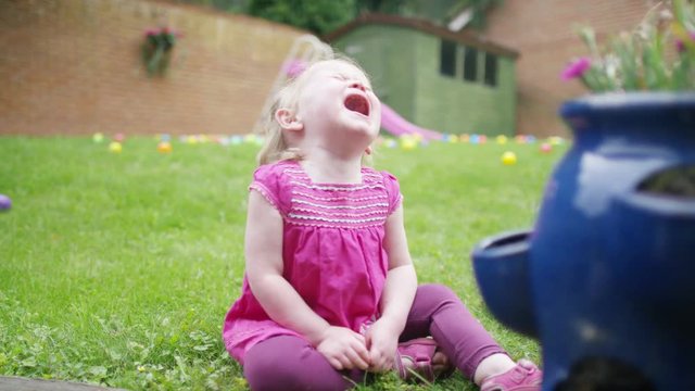  Tears & tantrums - Portrait of little girl crying in the garden