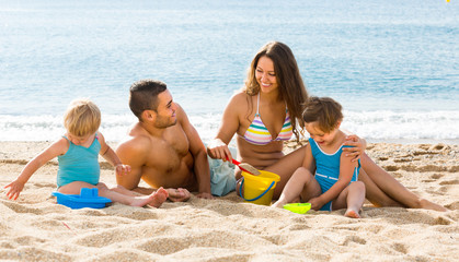 Family of four at the beach