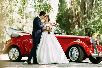 Sensual kiss of the two in their wedding day