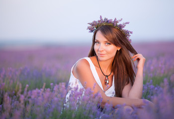 Beautiful young woman portrait in lavender field