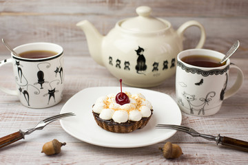 Two Cups of tea and cake  on the table