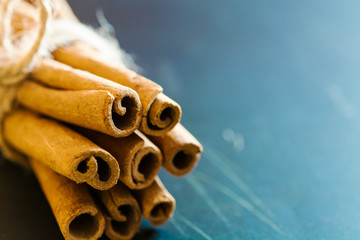 Bunch of cinnamon sticks on black background