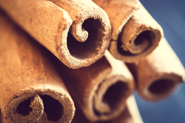 Cinnamon sticks on black background. Macro, closeup